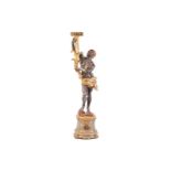 An Italian eighteenth-century style, parcel gilt and bronzed carved wood Blackamoor, the figure