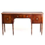 A George IV mahogany kneehole sideboard, with single frieze drawer and two deep cupboard doors on