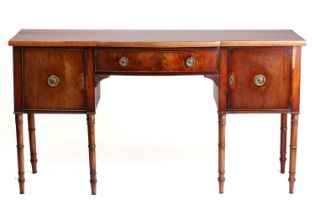 A George IV mahogany kneehole sideboard, with single frieze drawer and two deep cupboard doors on