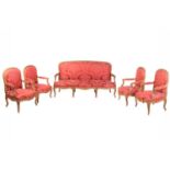 A Louis XV-style carved wood and gilt gesso salon suite, 20th century, with four fauteuils and