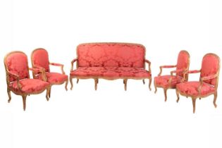 A Louis XV-style carved wood and gilt gesso salon suite, 20th century, with four fauteuils and