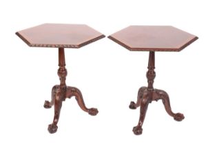 A pair of George III style carved mahogany hexagonal pillar tables, 20th century, with crossbanded