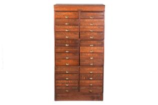 An "ADDRESSOGRAPH" modular oak flight of drawers of twenty-four drawers, early 20th century, each