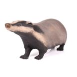 Nichola Theakston (b.1967), a large ceramic figure of a badger, realistically modelled, incised