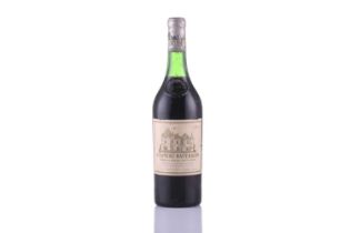 A bottle of Chateau Haut-Brion 1ere Grand Cru Classe, 1969 Good level, bottle has been stored