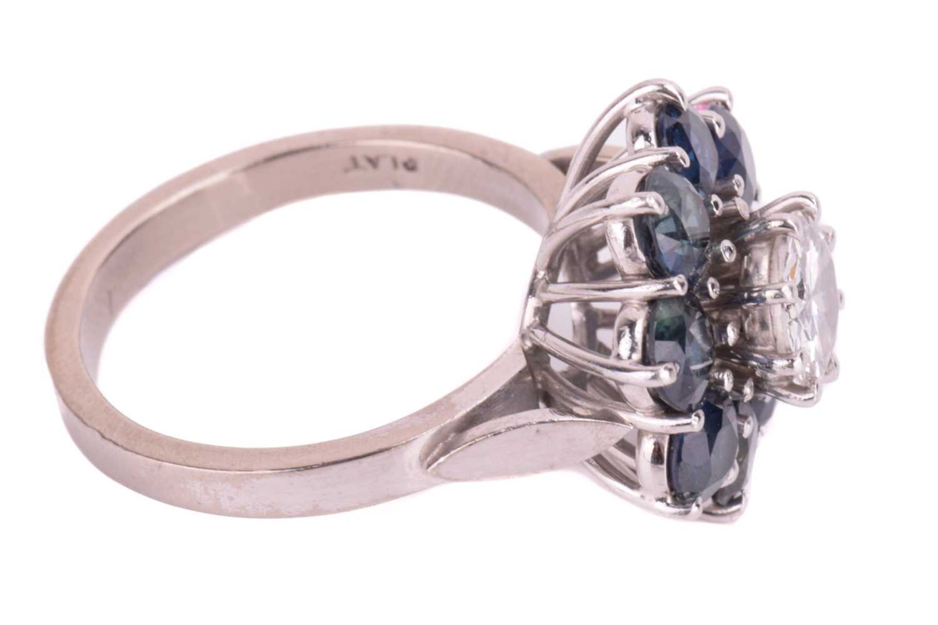 A diamond and sapphire flowerhead cluster ring, centred with a round brilliant-cut diamond of 6.2 - Image 4 of 5