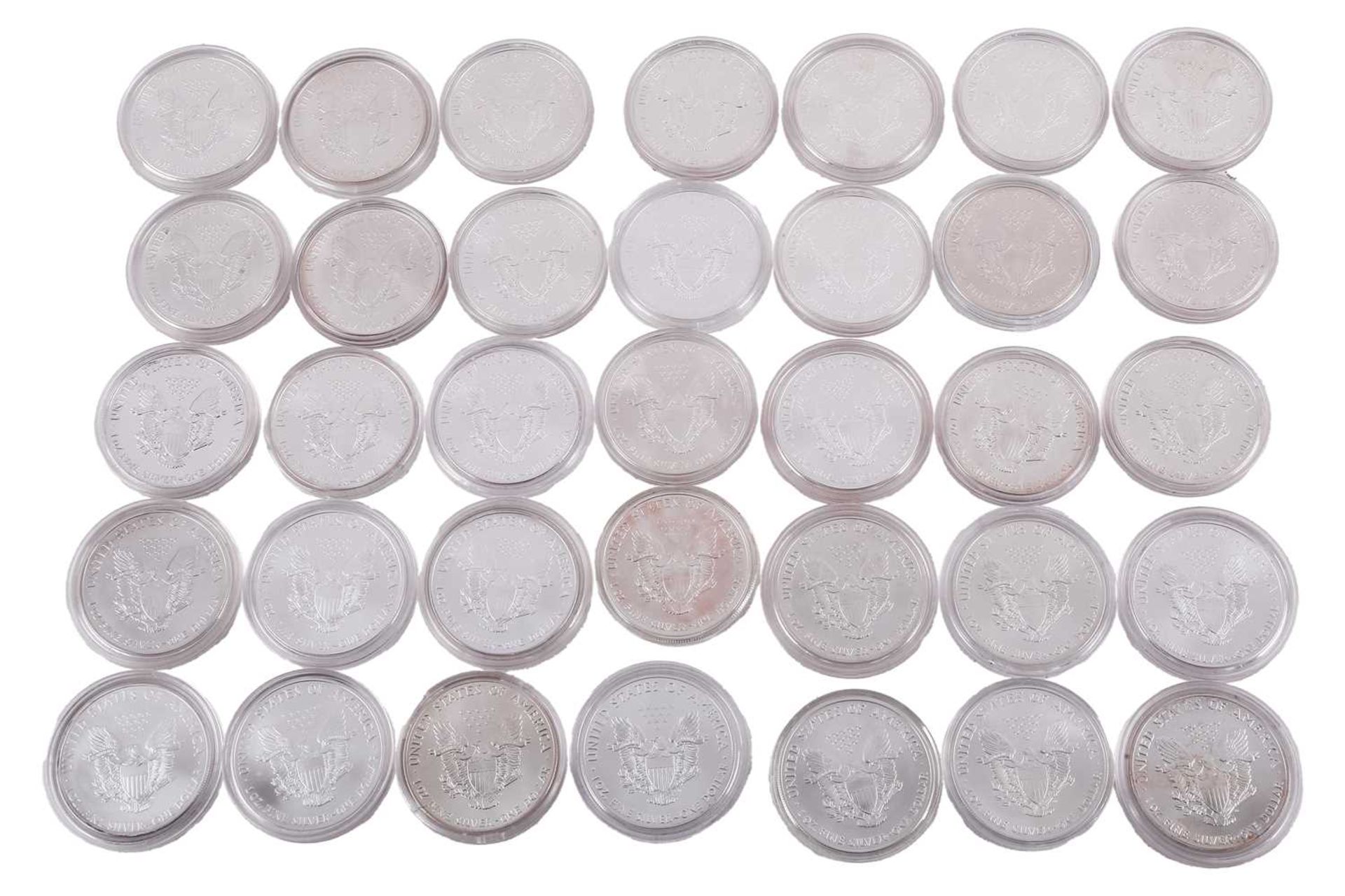 A collection of thirty-five United States of America 1oz silver proof dollars, each encapsulated,