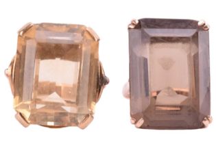 Two large quartz cocktail rings; the first comprises an octagonal step-cut smokey quartz of brown