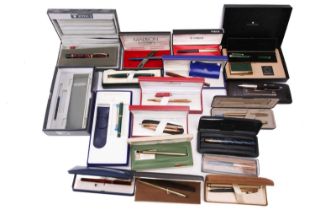 A collection of boxed pens, including various pens by different makers such as Parker, Cross,