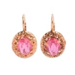 A pair of Italian single-stone pink paste earrings; the oval cut pastes in claw mounts within a