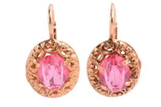 A pair of Italian single-stone pink paste earrings; the oval cut pastes in claw mounts within a