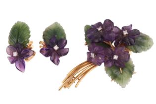 A suite of carved nephrite and amethyst brooch and earrings designed as floral sprays; the brooch