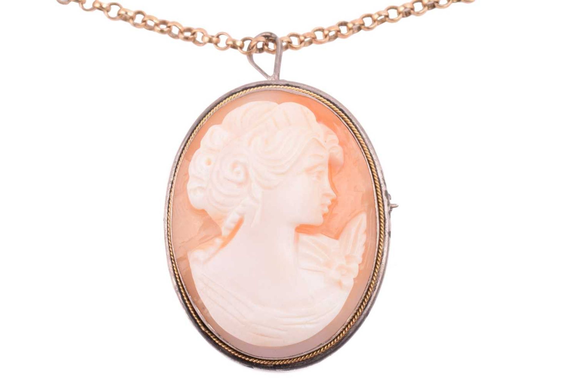 A shell cameo brooch measuring 33 x 25mm in white metal marked '800', on a gold chain with hallmarks - Image 2 of 4