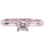 A single stone diamond ring; the princess diamond in four claw mount, to tapered shoulders and plain