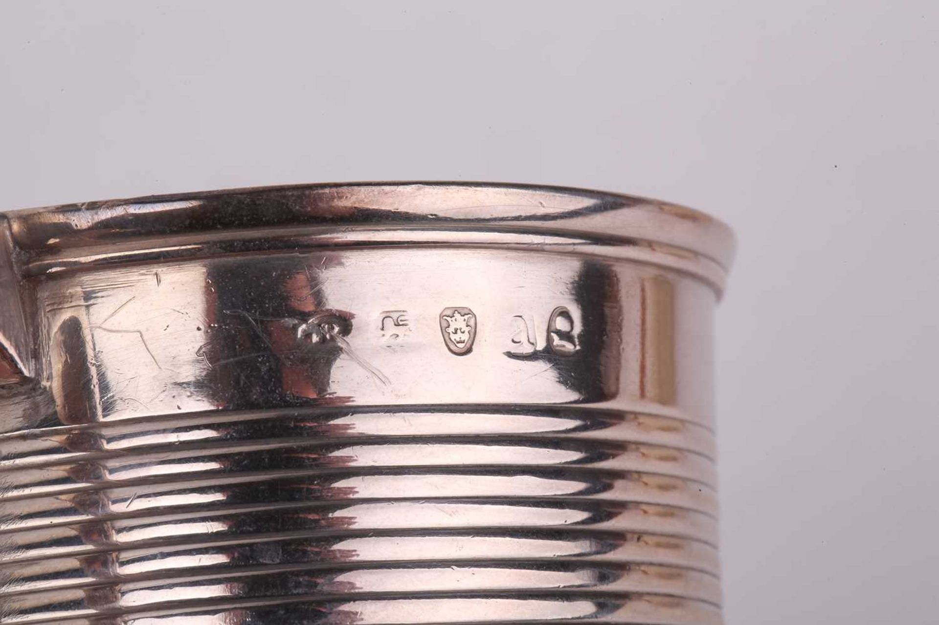 A cased silver christening set comprising a Christening mug, egg cup and spoon, napkin ring, - Image 3 of 7