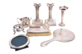 A small collection of silver comprising a George II silver cauldron salt cellar, a pair of stop-