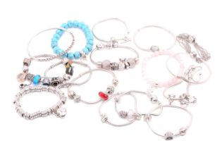 An aggregate of branded bracelets in white metal; comprising thirteen Pandora bracelets with a