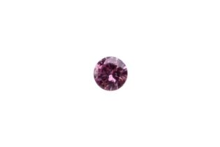 A 0.09ct loose purplish-pink Argyle diamond, round modified brilliant-cut, accompanied by a Delta