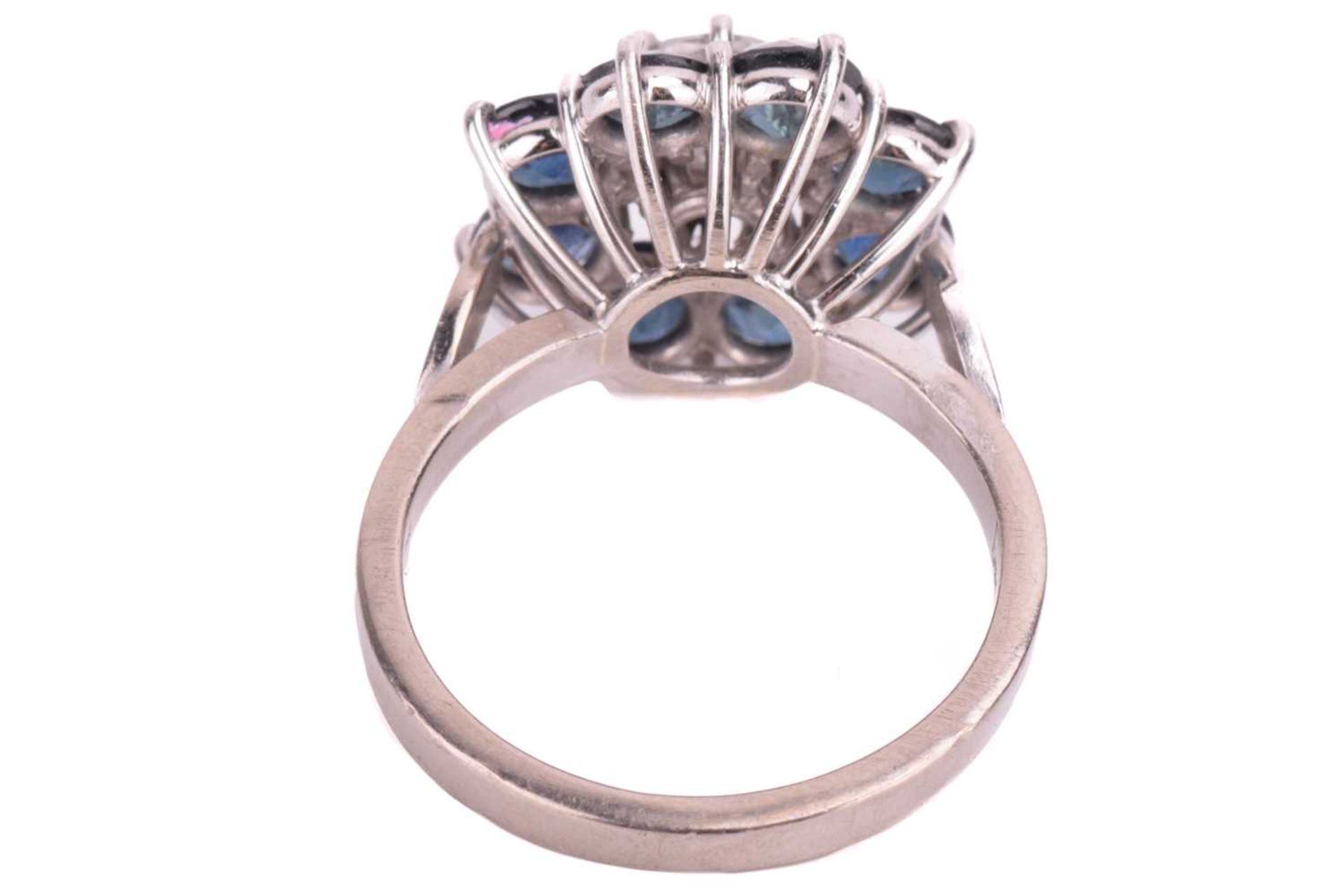 A diamond and sapphire flowerhead cluster ring, centred with a round brilliant-cut diamond of 6.2 - Image 3 of 5