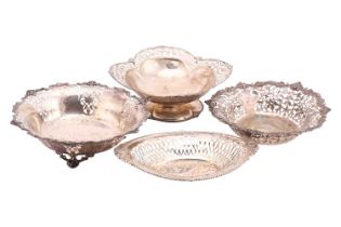 Four silver pierced bowls, one of round form with three cast feet, Mappin and Webb, Sheffield