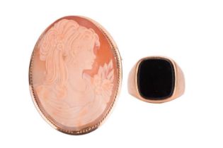 A large shell cameo brooch and a signet ring; the brooch depicts a portrait of a lady, within a