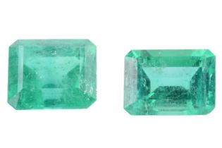 Two loose emeralds; the larger with a weight of 1.55ct, measuring 7.3 x 6.6 x 4.7mm, the smaller