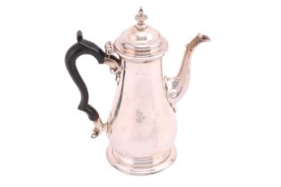 A George II silver coffee pot, London date letter worn, possibly John Payne, of baluster form with