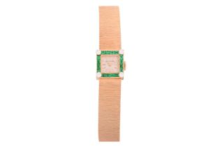 A Grant A. Peacock lady's dress watch set with synthetic emeralds and diamonds, featuring a hand-