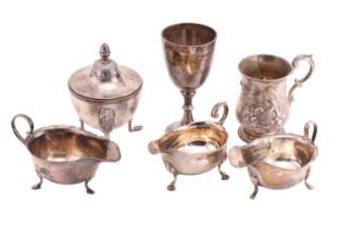 A small collection of silver items, comprising three sauceboats, a Victorian mug, a silver chalice