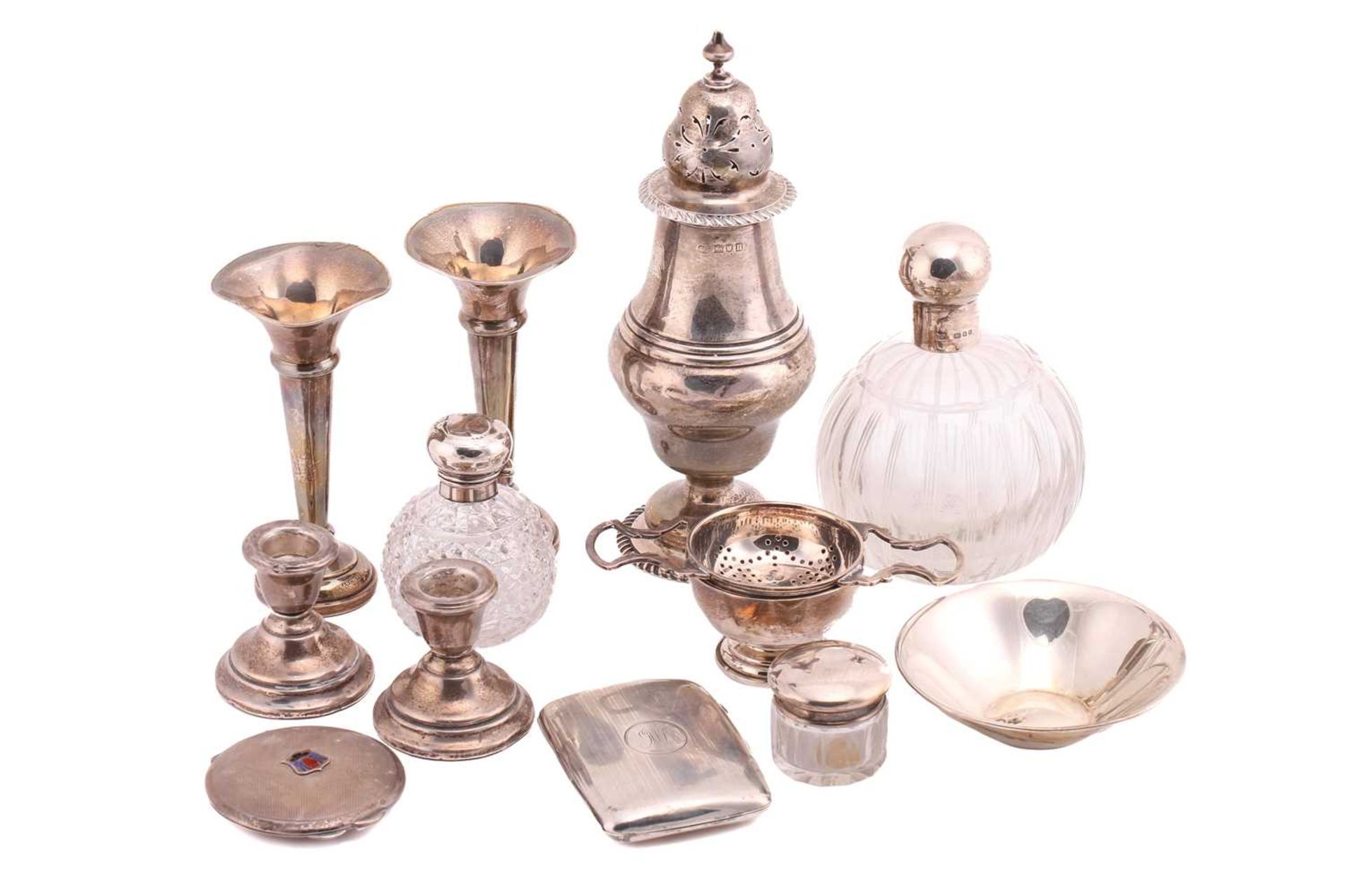 A mixed collection of silver comprising a Garrard caster of baluster form 21.5cm high, a cigarette
