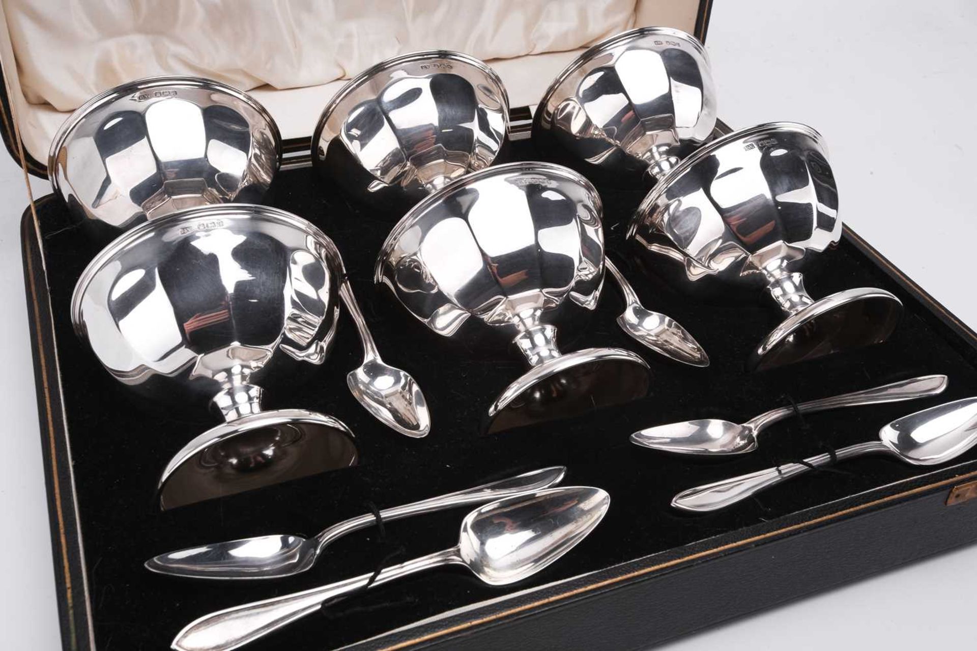 A cased silver grapefruit set; comprising six panelled bowls on spreading trumpet feet and six - Image 2 of 3