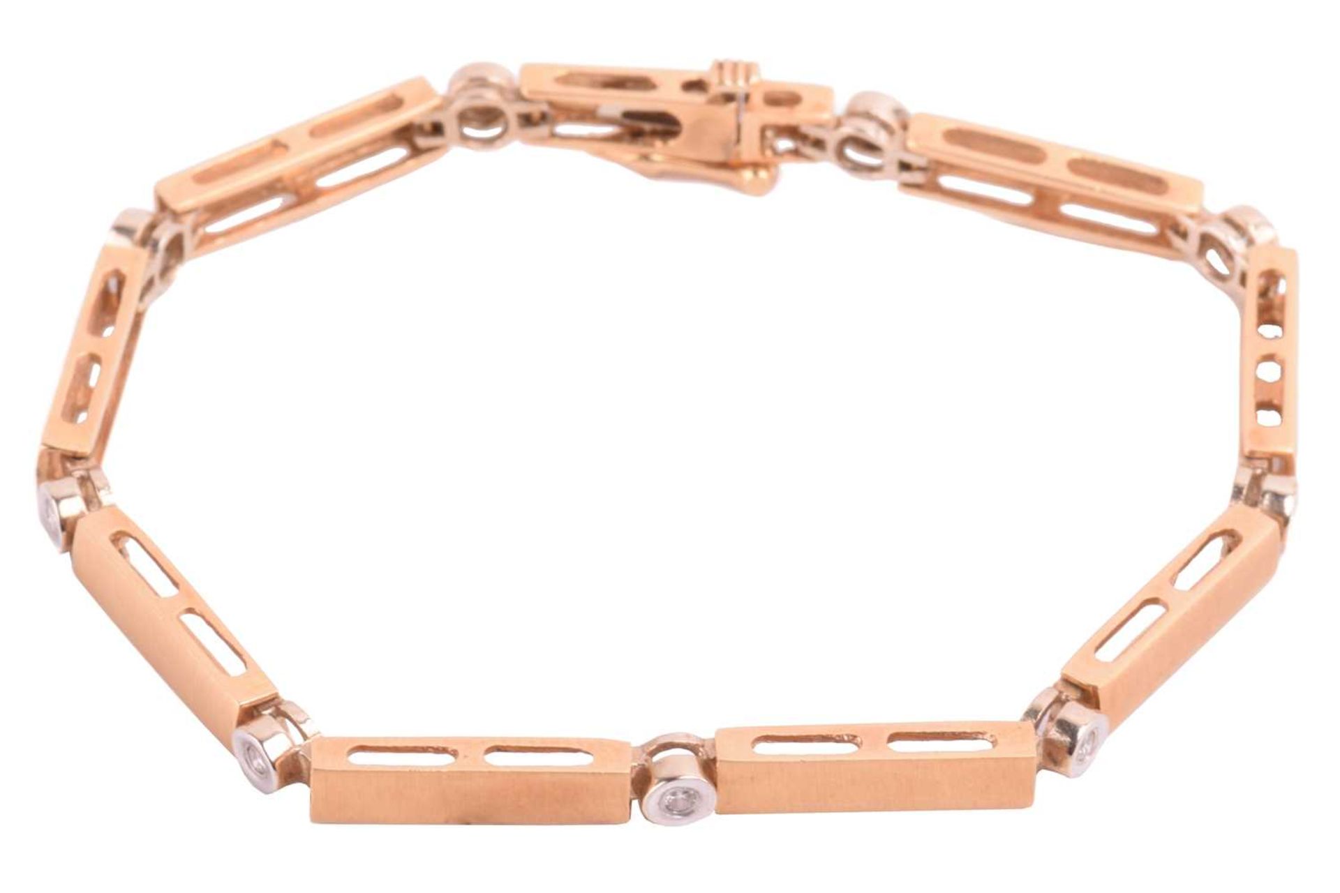 An 18ct gold bar link bracelet with diamond-set spacers, comprising a line of bar links with brush