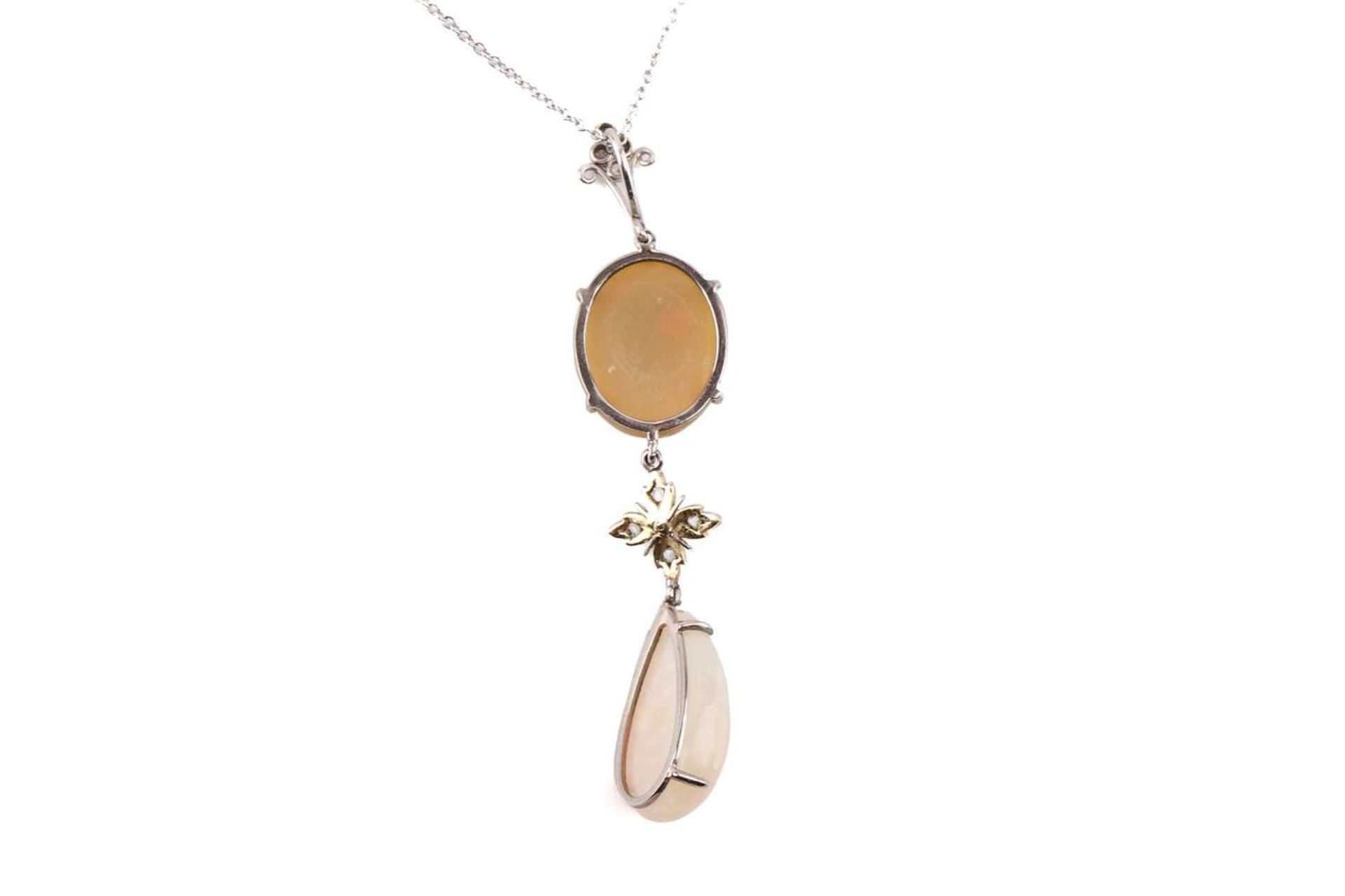 An opal and diamond pendant set with a yellow-brown fire opal suspending a floral motif set with - Image 3 of 3