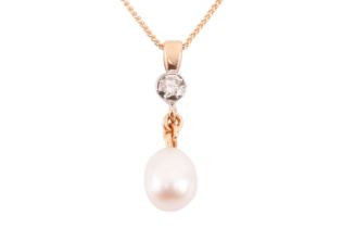 A cultured pearl and diamond pendant on chain, comprising an egg-shaped freshwater cultured pearl of