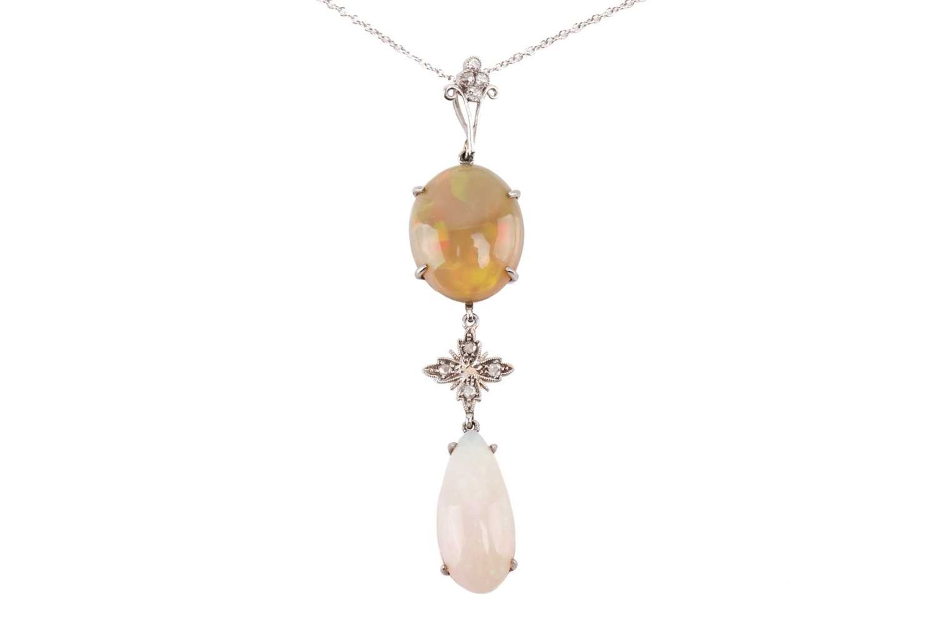 An opal and diamond pendant set with a yellow-brown fire opal suspending a floral motif set with - Image 2 of 3