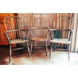 Two similar ash and elm Windsor armchairs, spindle back, baluster turned supports; and another