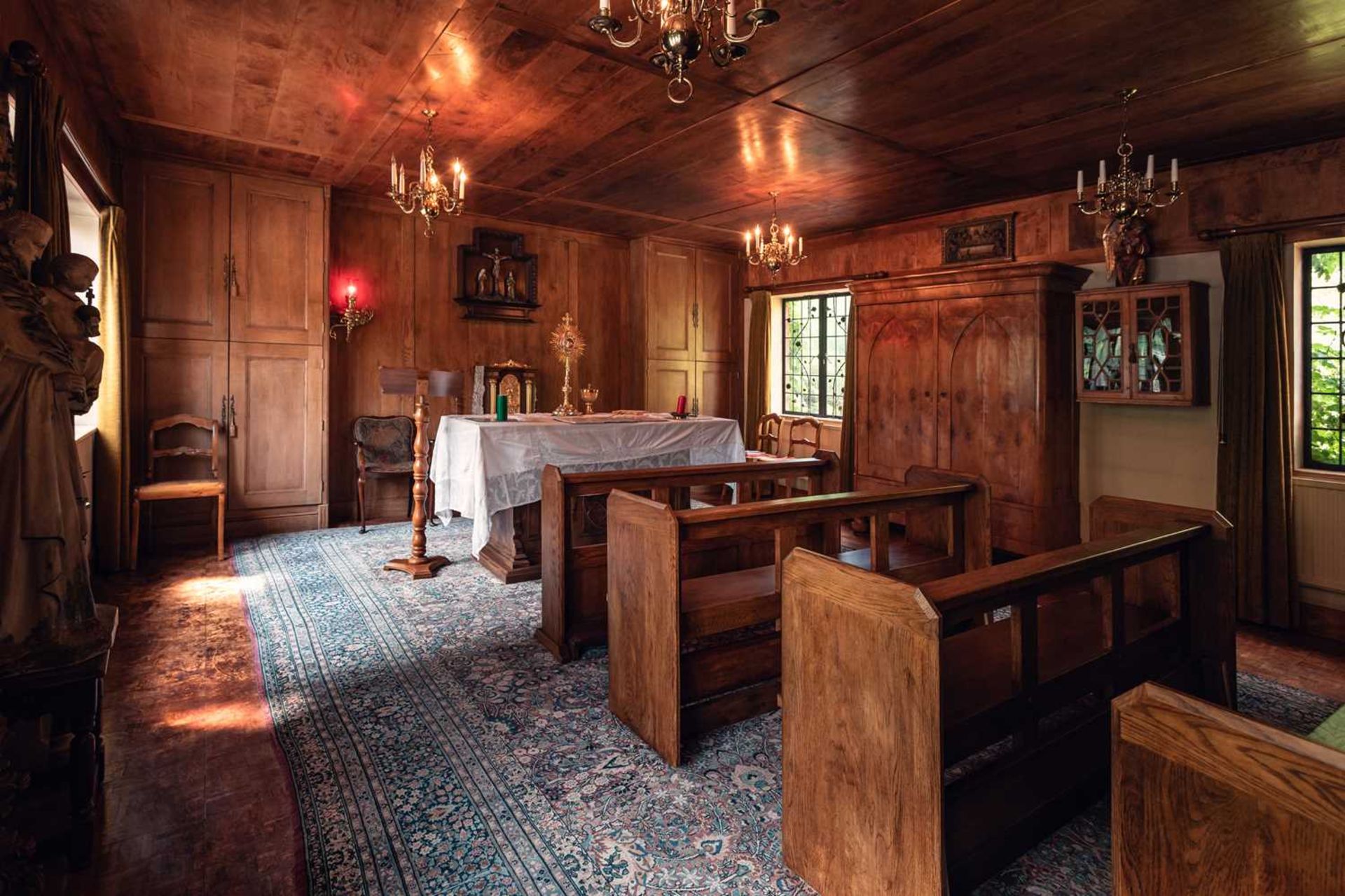 Three stained oak church pews, 20th century, each 85 cm high x 180 cm wide, together with