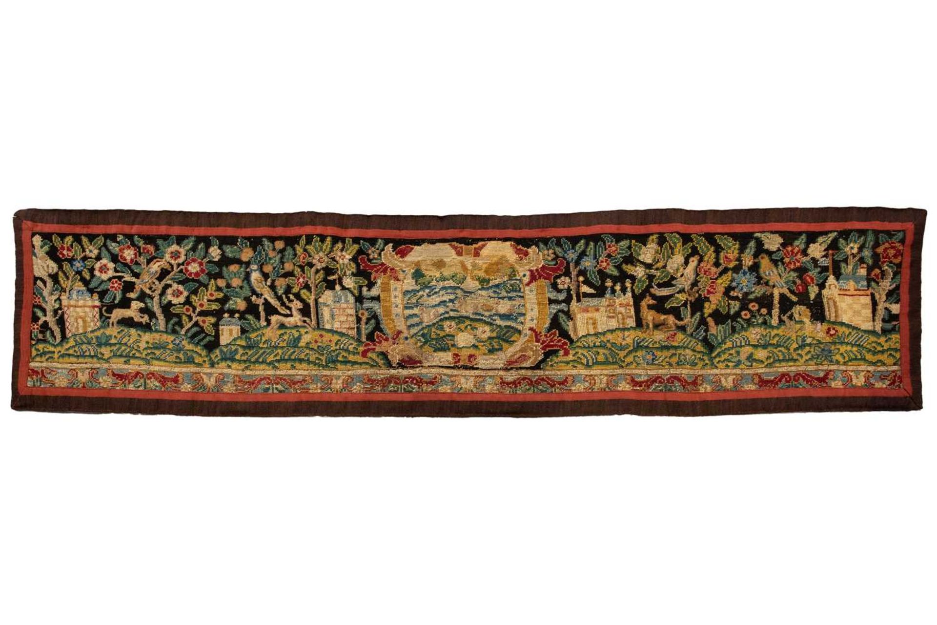 A needlework runner, possibly 18th century and later, the scene in petite and gross point, 120 cm