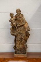 An 18th-century Northern European softwood carved figure of the Madonna and Child, hollowed back,