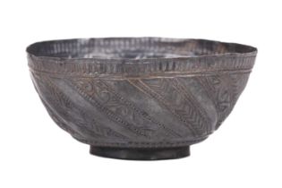 An Indo-Persian silver Piala cup with embossed wrythern decoration, 9 cm diameter x 4 cm high.