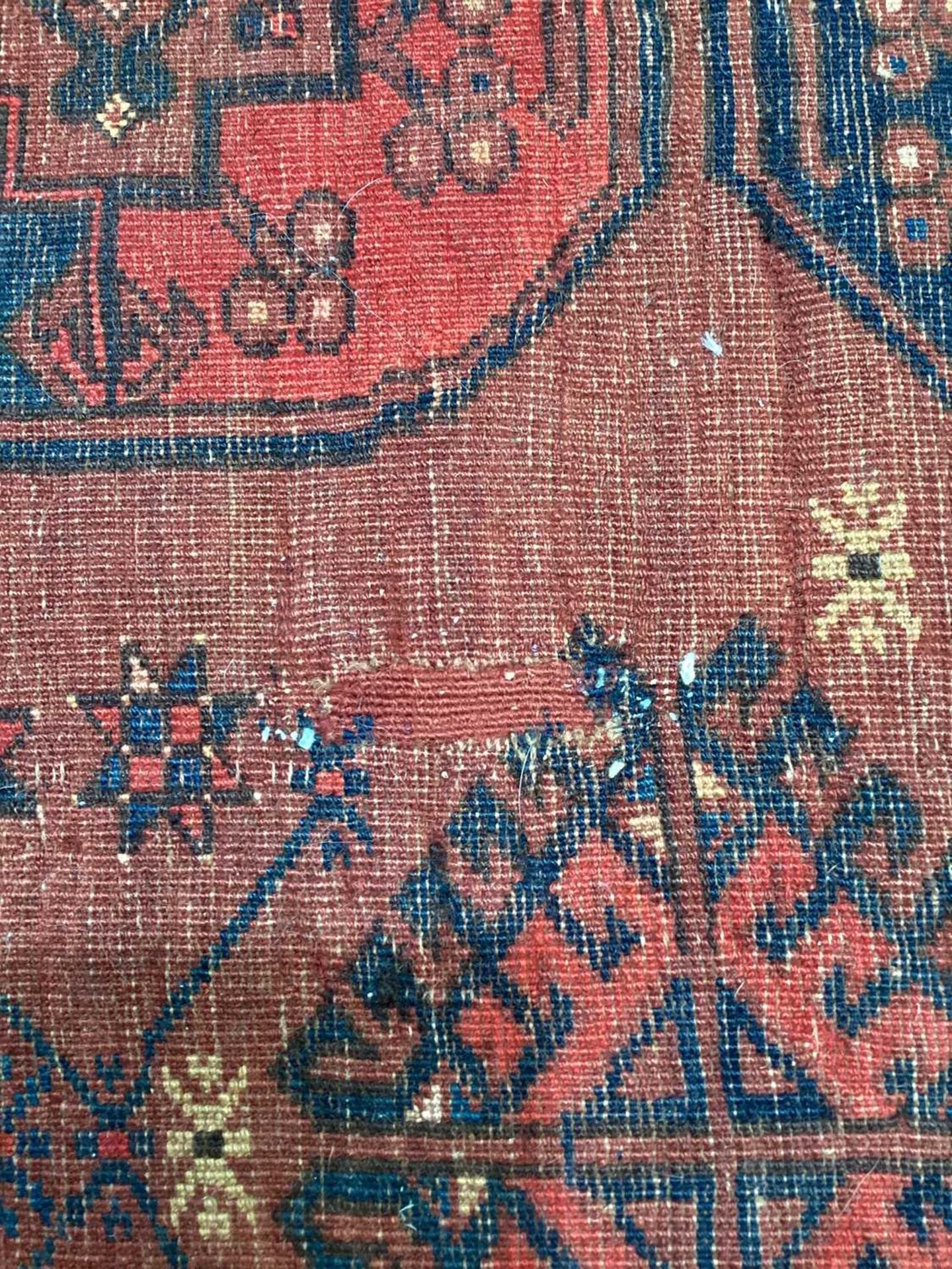 A large antique "Old country house" red ground Afghan carpet, with three rows of elephant foot - Image 25 of 28