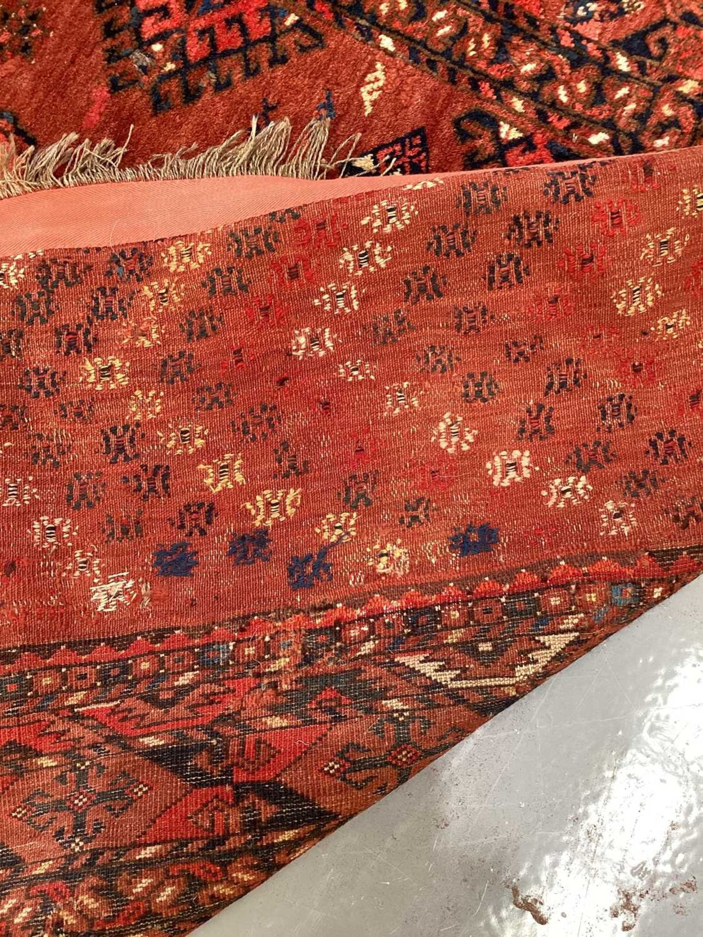 A large antique "Old country house" red ground Afghan carpet, with three rows of elephant foot - Image 22 of 28