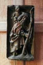 A 16th-century Rhenish polychrome painted carved wood figural group of St Christopher carrying the