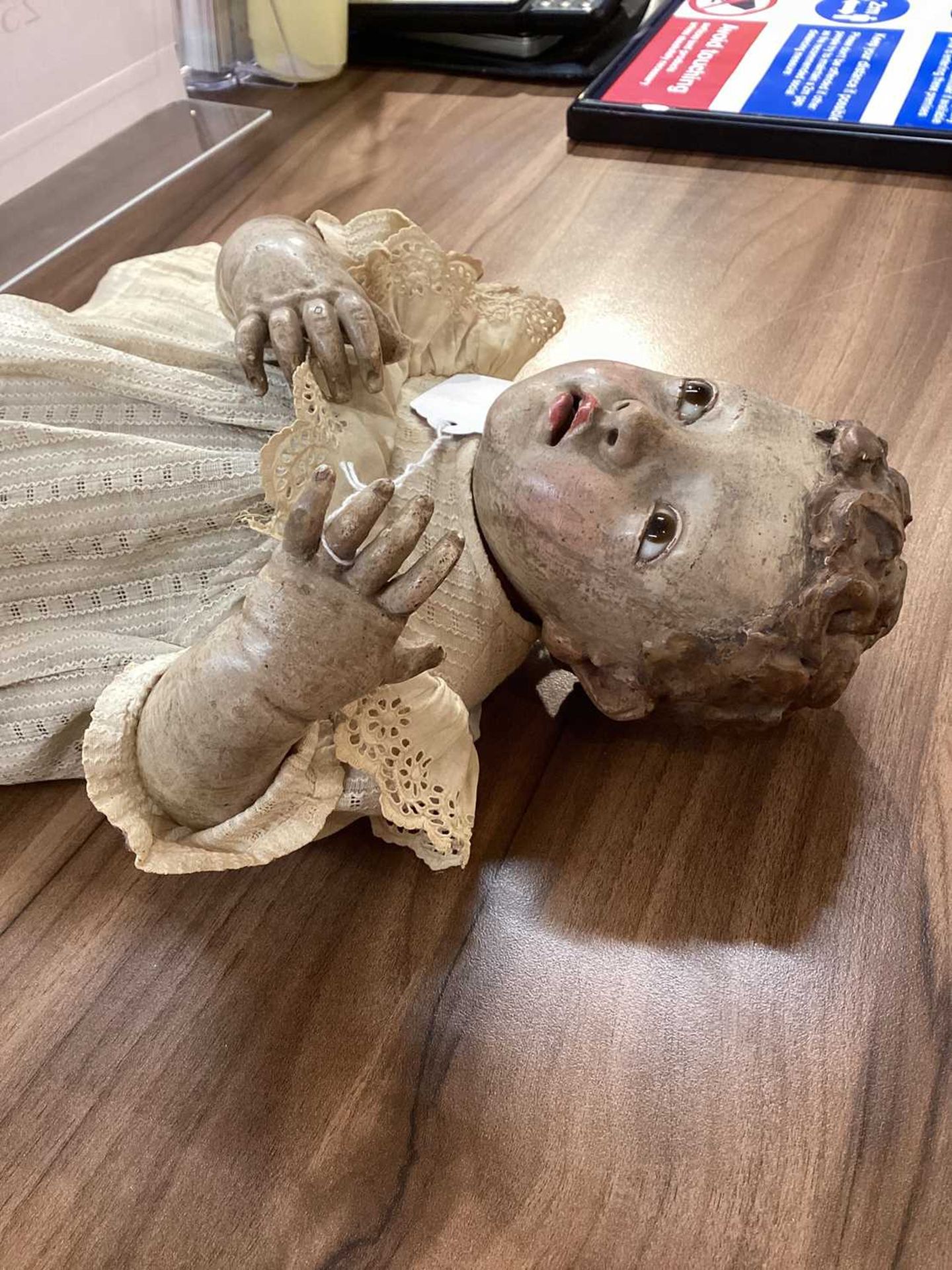 An 18th-century Spanish carved and polychromed wood figure of a cherub, with inset glass eyes, and - Image 6 of 9