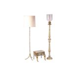 A "Hollywood Regency" gilt brass faux bamboo standard lamp, with an outswept tripod base, 167 cm