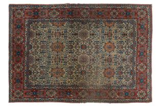 An antique ivory ground Kerman rug with an allover floral design within multiple borders 202 x 137cm