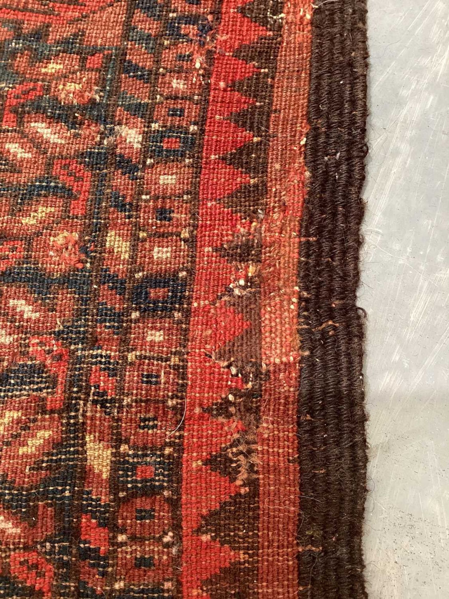 A large antique "Old country house" red ground Afghan carpet, with three rows of elephant foot - Image 23 of 28