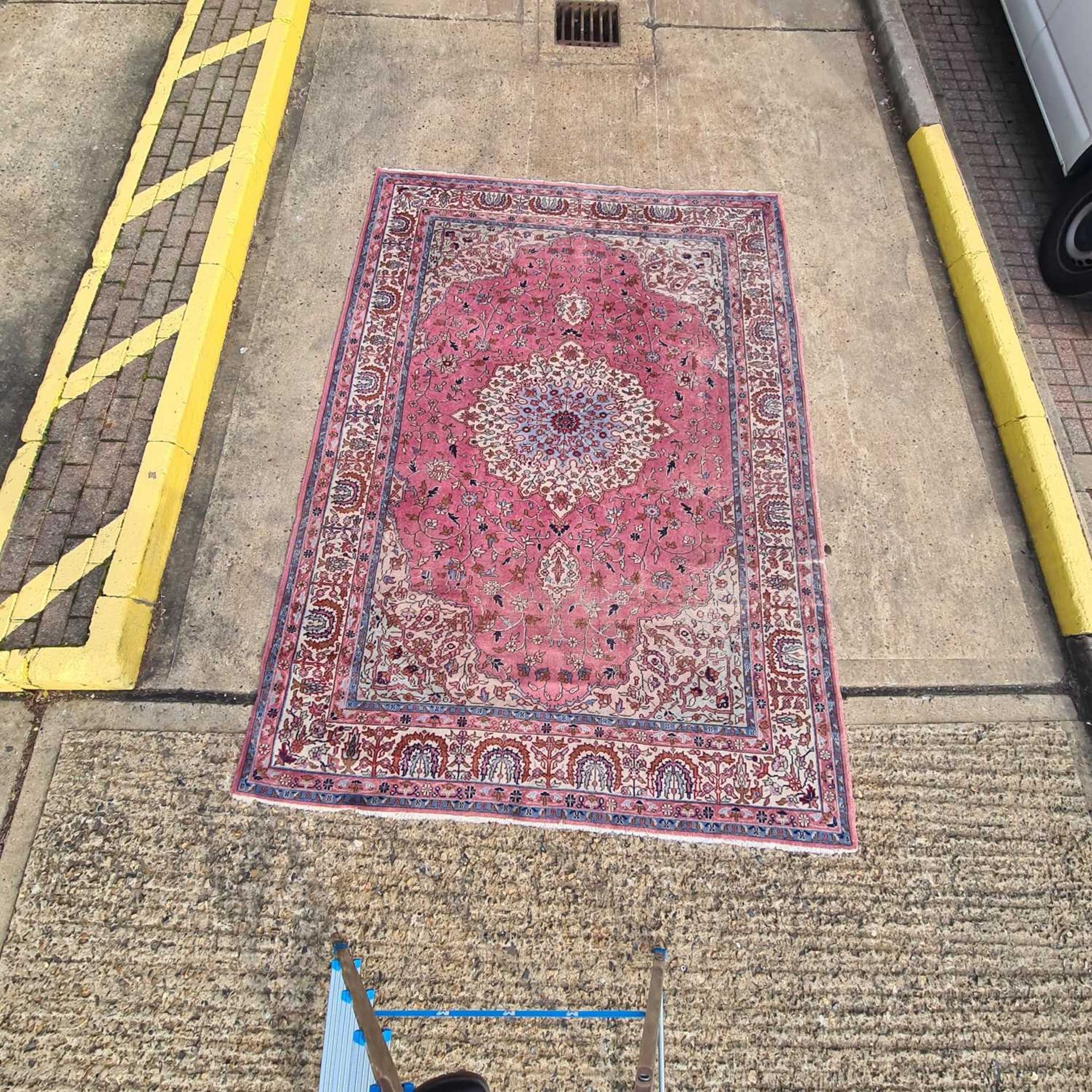 An old pastel pink ground possibly Turkish carpet with a central boss with hanging lanterns within - Image 2 of 2