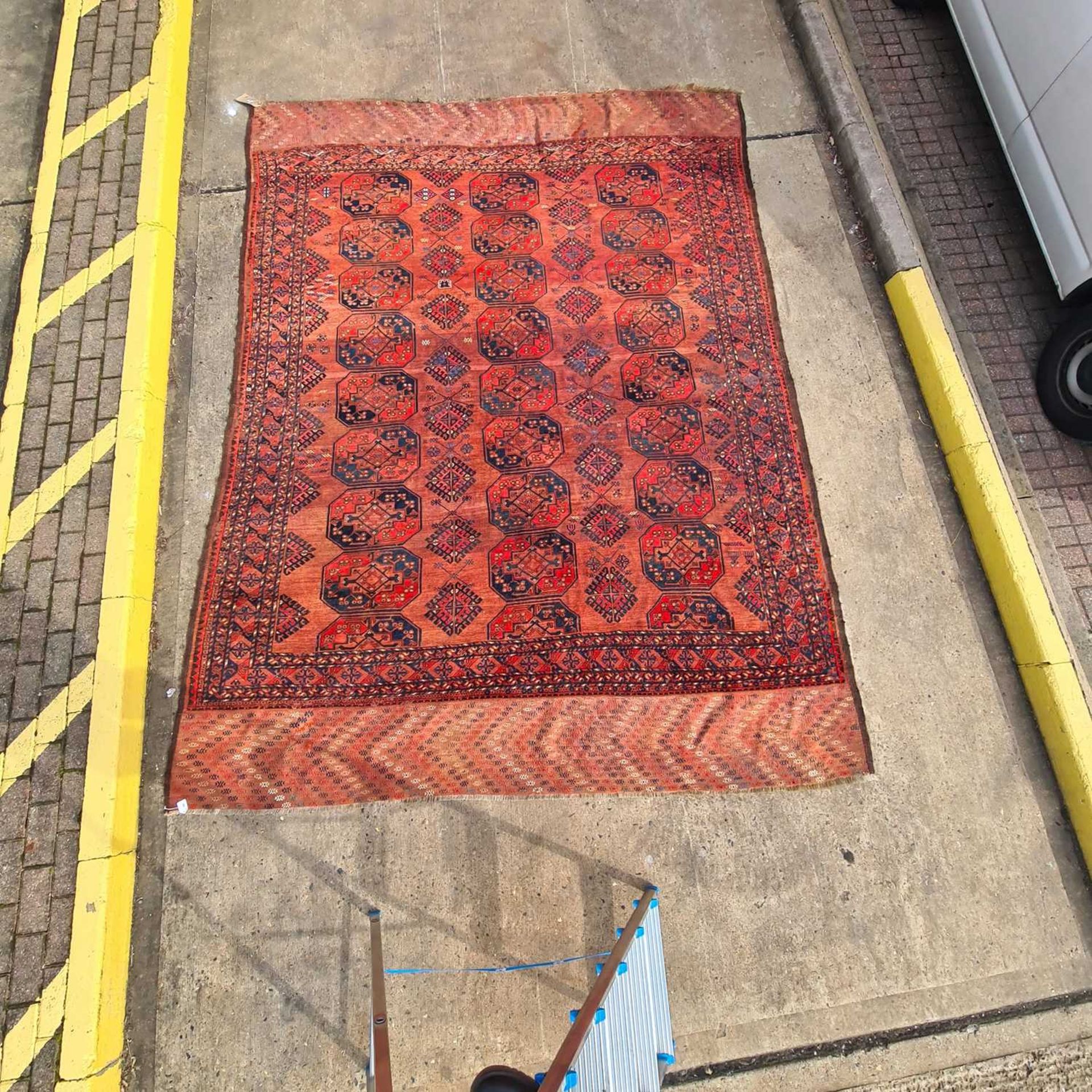 A large antique "Old country house" red ground Afghan carpet, with three rows of elephant foot - Image 2 of 28