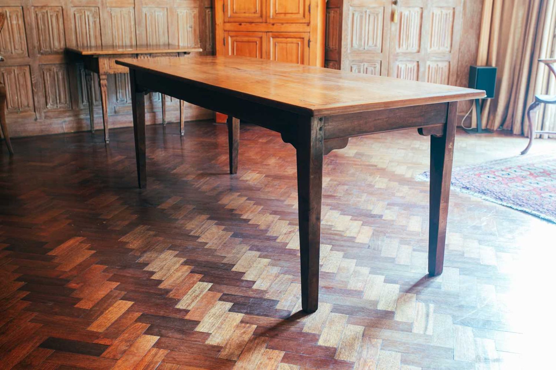 An early 19th-century French fruitwood kitchen table, drawer to one end, 78 cm high x 207 cm x 79